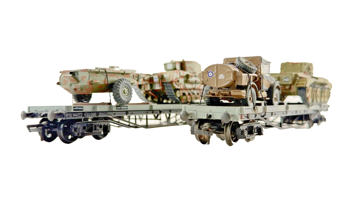 BACHMANN/MAINLINE OO GAUGE - PAIR OF BOLSTER WAGONS WITH ARMY MILITARY LOADS