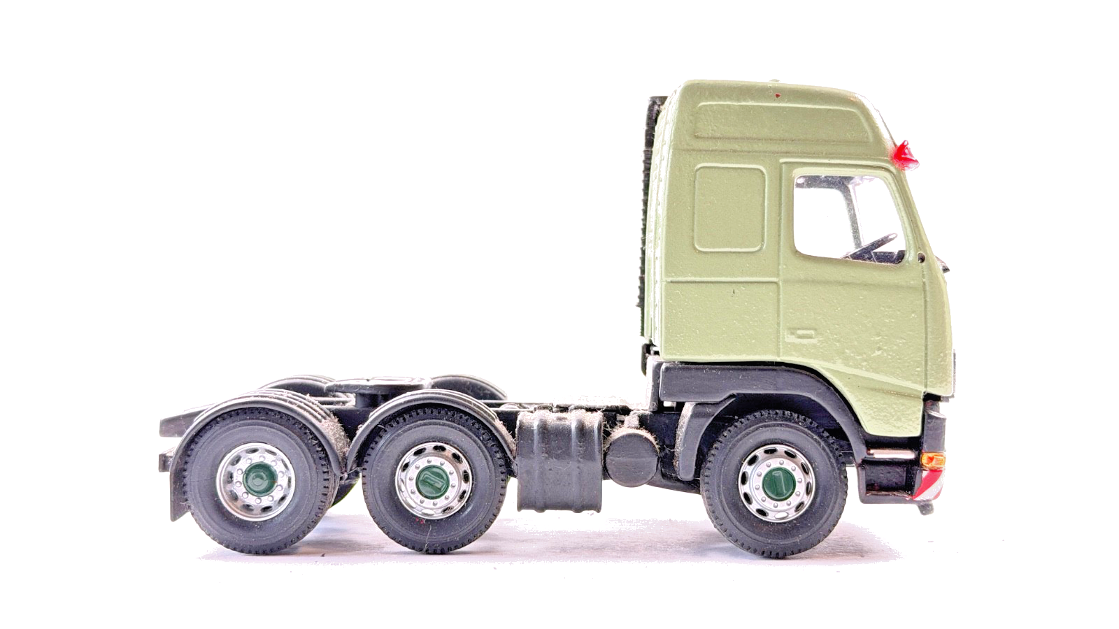 CORGI 1/50 SCALE REPAINTED GREEN VOLVO FH12 6X2 TRACTOR UNIT UNBOXED